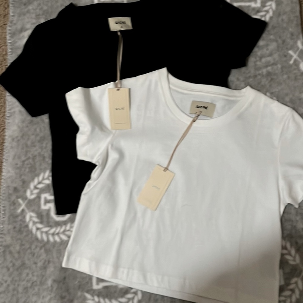 1 white and 1 black baby tee size XS